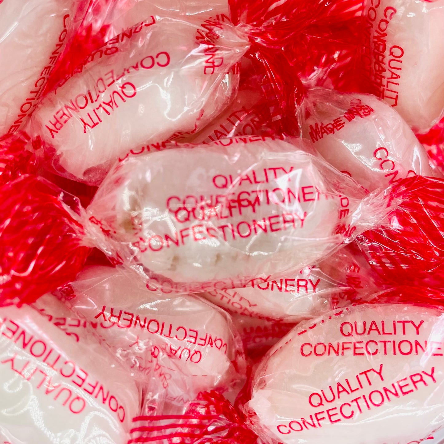 White Coloured Old English Mints in clear wrappers Made By Stockley's