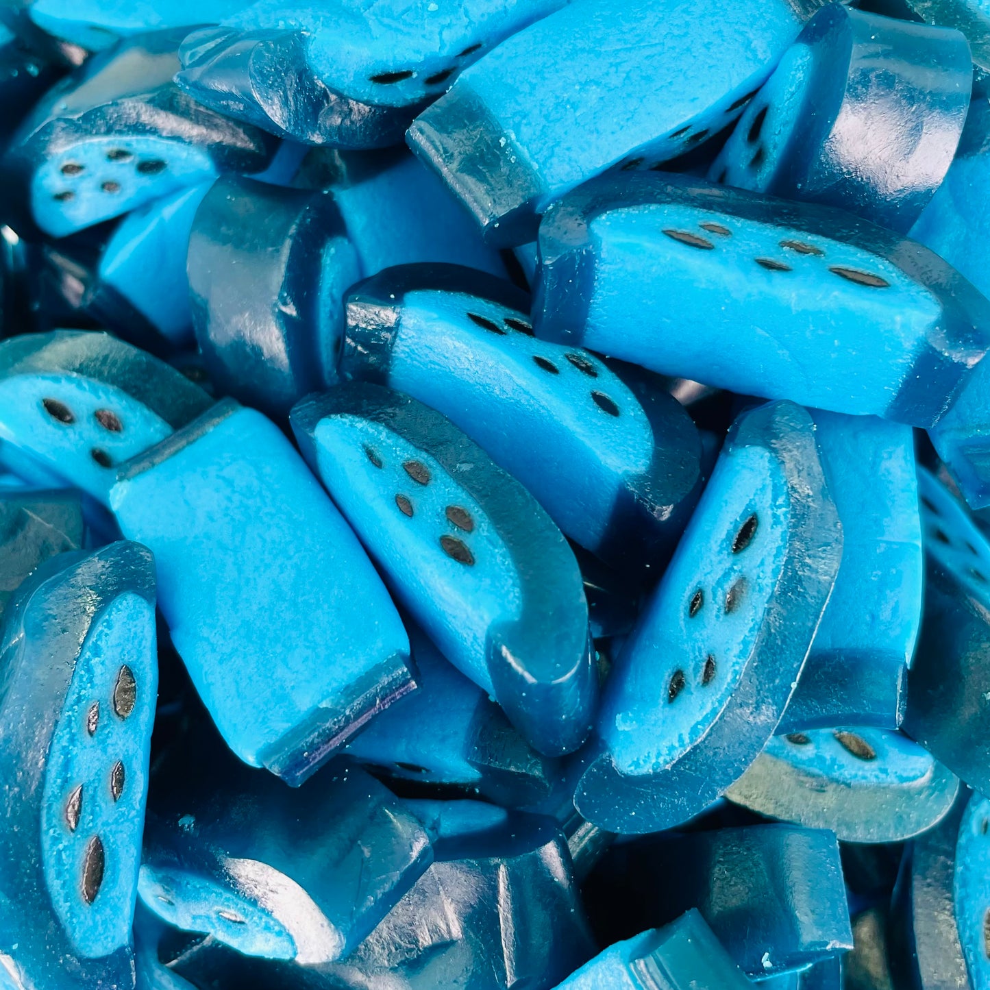 Raspberry flavoured sweets with black liquorice dots in the middle