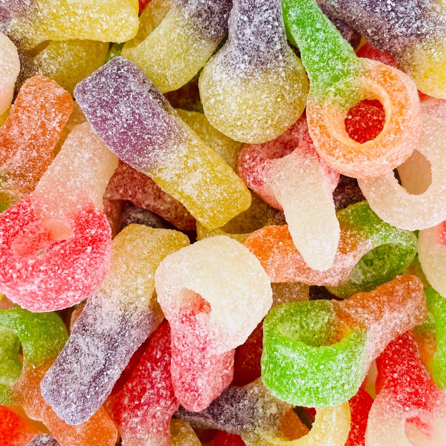 Dummy shaped jelly sweets coating with fizzy sugar