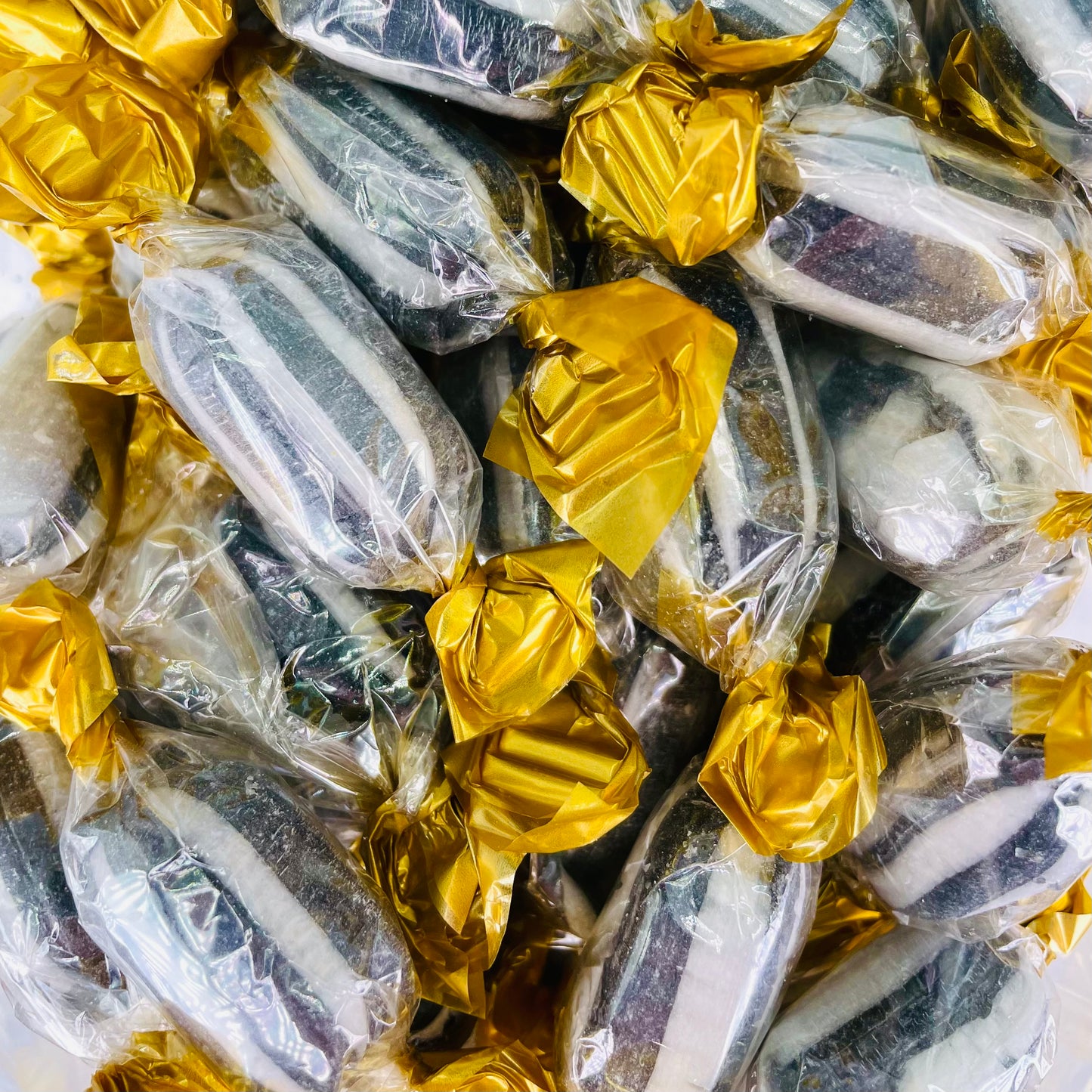 Black and white Everton Mints individually wrapped in a clear wrapper