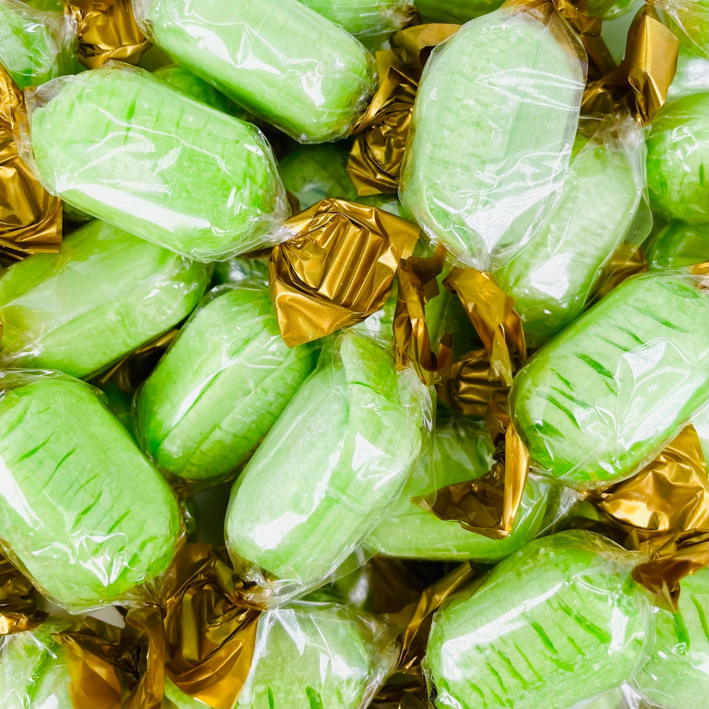 Green coloured chocolate limes in clear wrappers