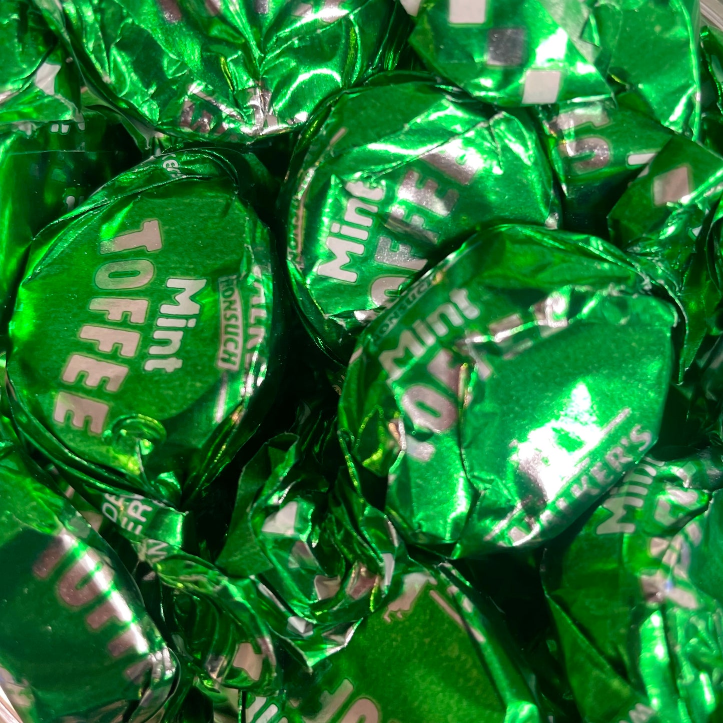 Mint toffees wrapped in green