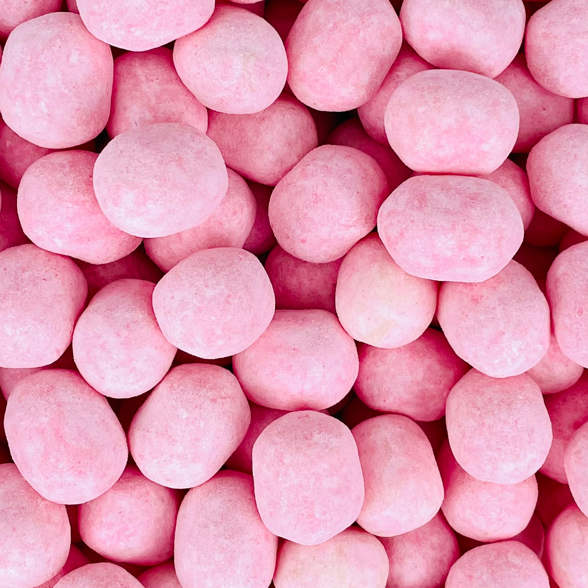 Round Strawberry bon bons in a pink colour 
